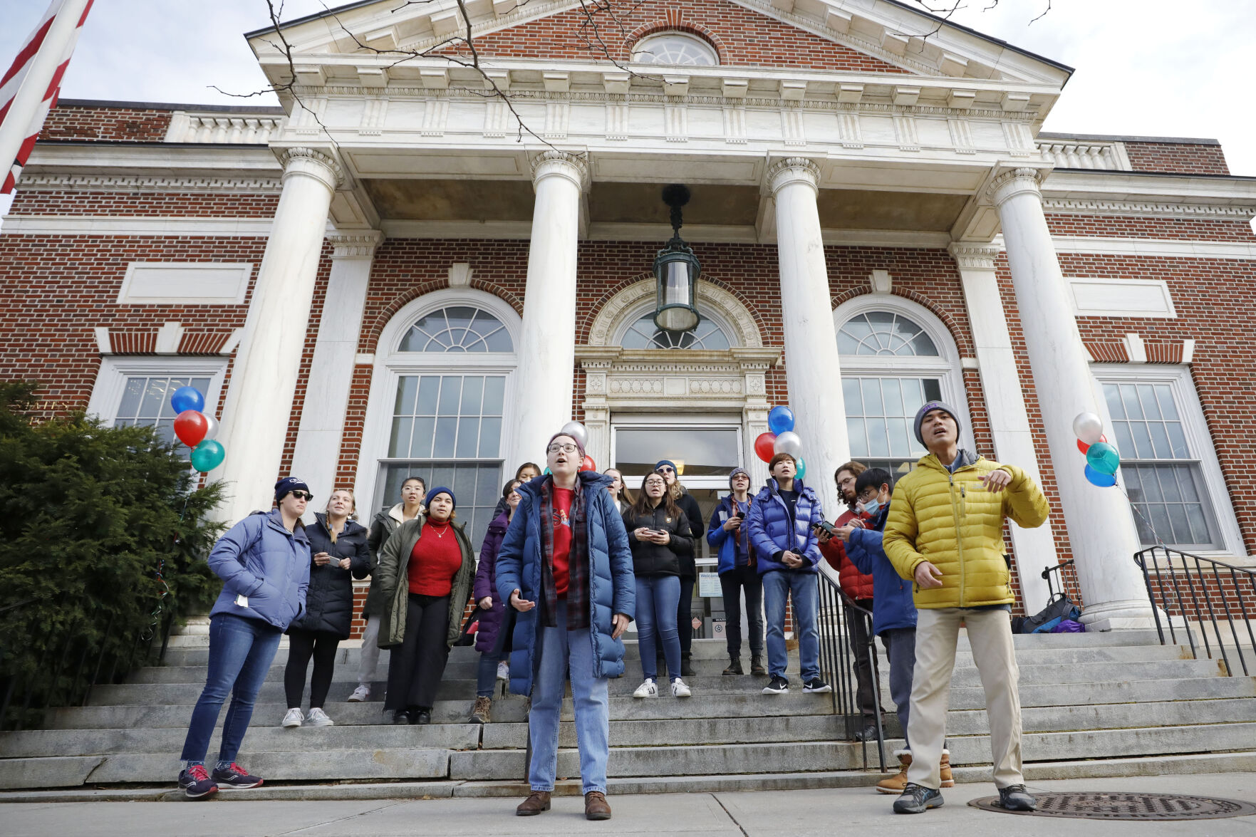 singers on steps of post office